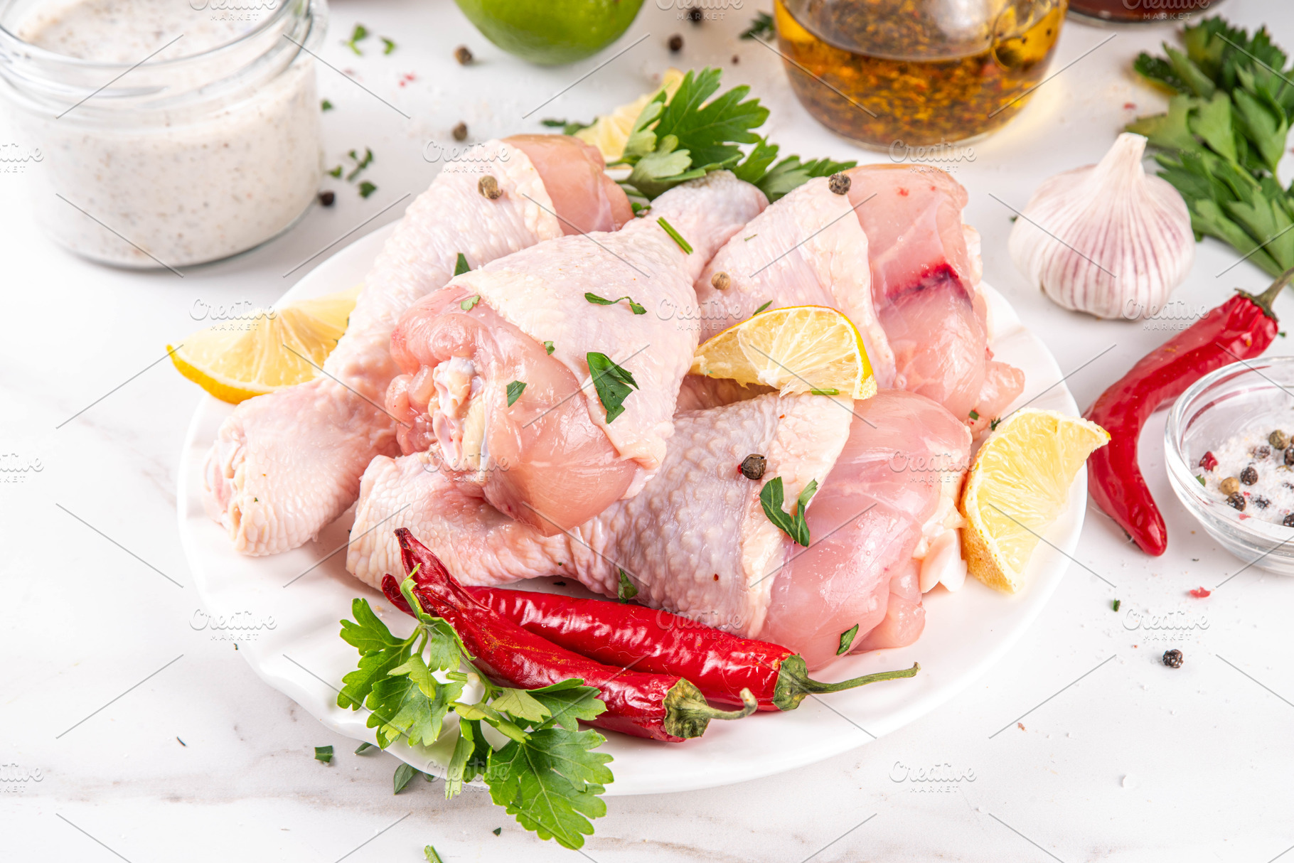 Fresh raw organic chicken legs, drumsticks, with spices and cond, a Food & Drink Photo by Rimma