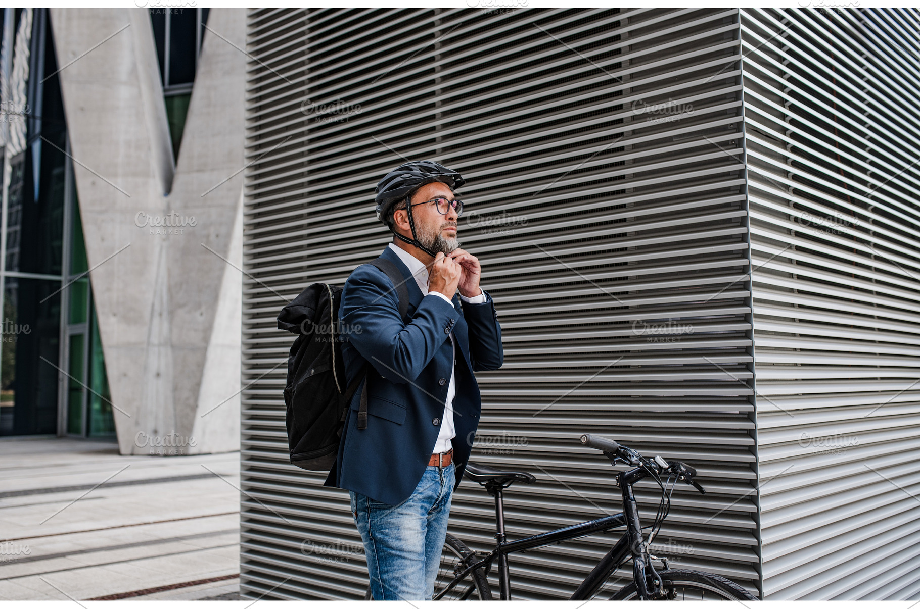 Urban commuter putting helmet on, a Person Photo by HalfPoint