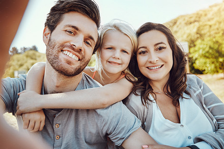 Selfie, park and portrait of girl with parents enjoy quality time on holiday, weekend and nature together. Family, love and happy child, mom and dad smile for bonding, relax and adventure in summer, a Photo by Peopleimages.com