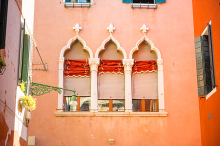 Windows on red wall in old house, an Architecture Photo by Vapi