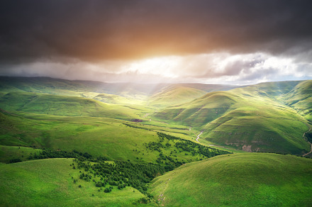 Green mountain hills during the sunset., a Background Photo by djgis