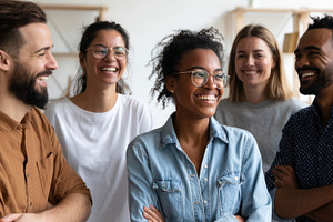 Diverse group of young adults laughing together, a Person Photo by AlyaAnd