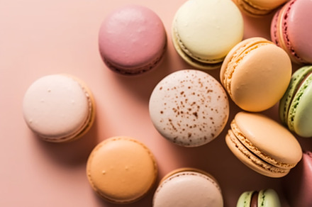 Macaroons on cream pastel background, chic cafe dessert, sweet f, a Food & Drink Photo by Anneleven