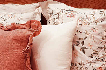 Vintage countryside style bedding with floral pattern on wooden, an Architecture Photo by Anneleven