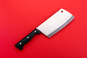 Large stainless steel cleaver knife with black handle placed on, a Food & Drink Photo by Ales Munt