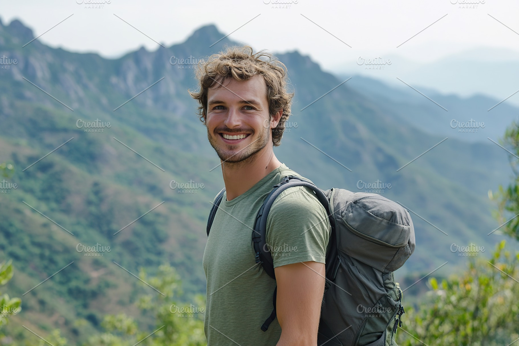 Smiling athletic man enjoying a hike in the mountains during a sunny day, a Person Photo by AlyaAnd