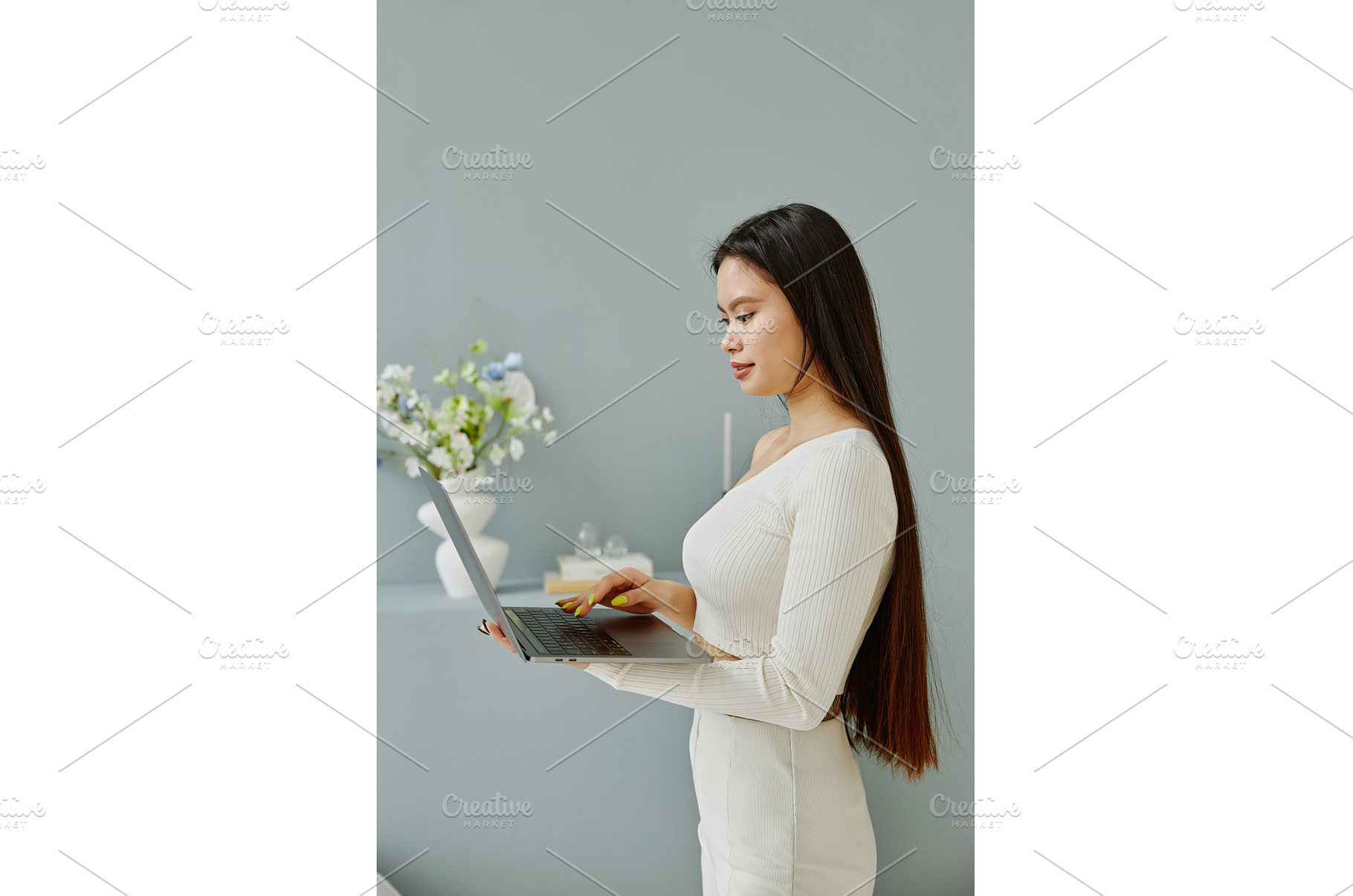 Side view of young Asian woman using, a Person Photo by Aliona Serzhanova