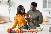 Cheers For Us. Romantic Black Couple Drinking Red Wine In Kitchen, a Photo by Prostock-Studio (Thumbnail 2 of 5)