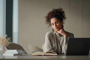 Contemplative woman reading, a Photo by Beautiful things