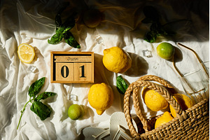 Fresh lemons and greens create a, a Nature Photo by IlliaBondarPhotography