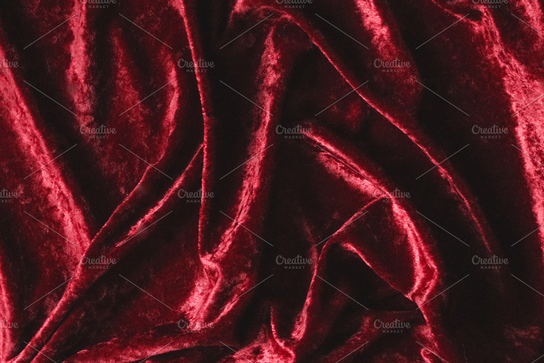 Red velvet fabric background showing soft luxurious texture and draped folds of, a Photo by Studio ANNA
