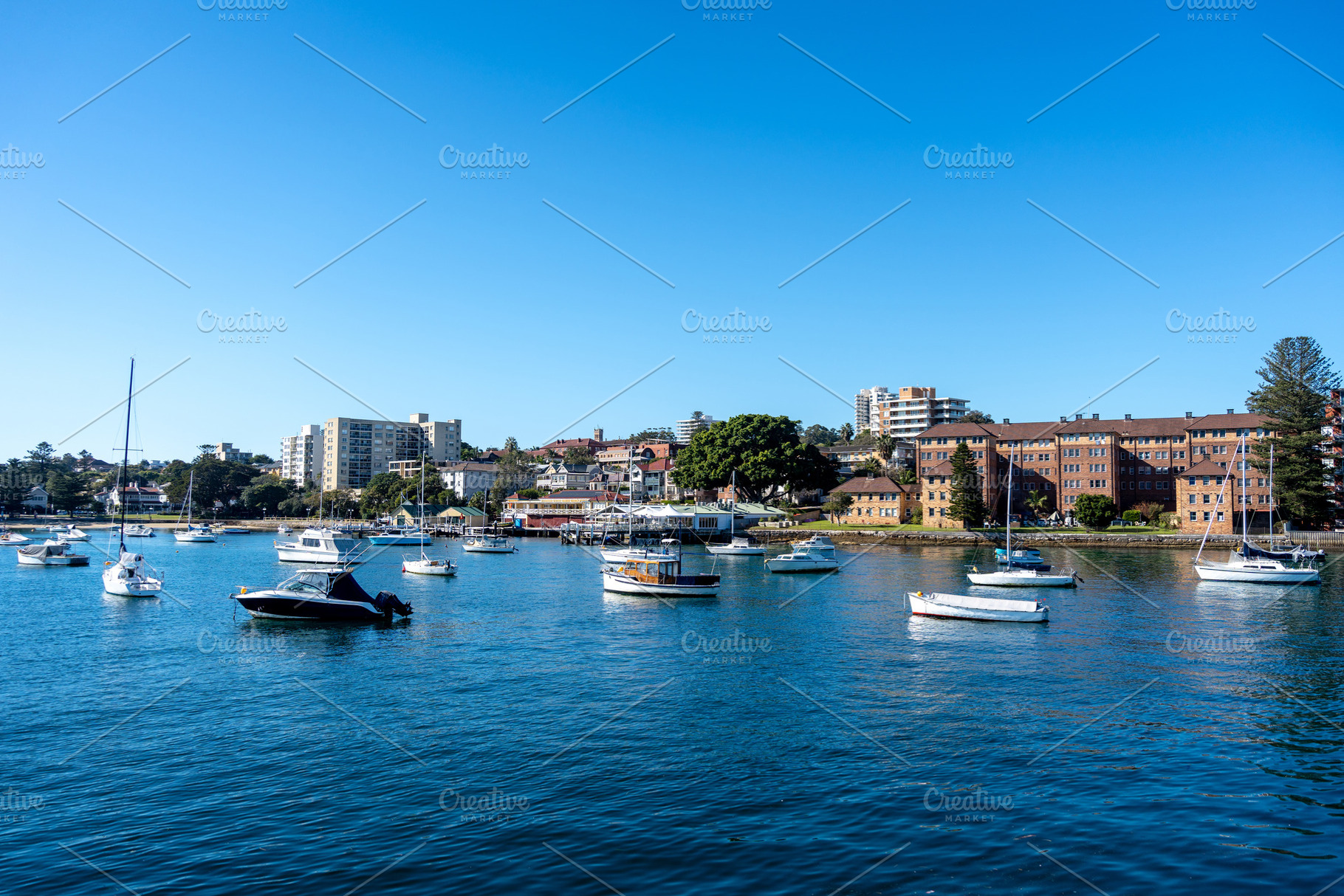 Manly Beach harbor with boats and waterfront buildings in Sydney, a Nature Photo by GoodGoods