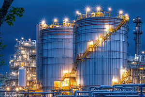 Illuminated Industrial Storage Tanks, a Photo by Pixeness Studio