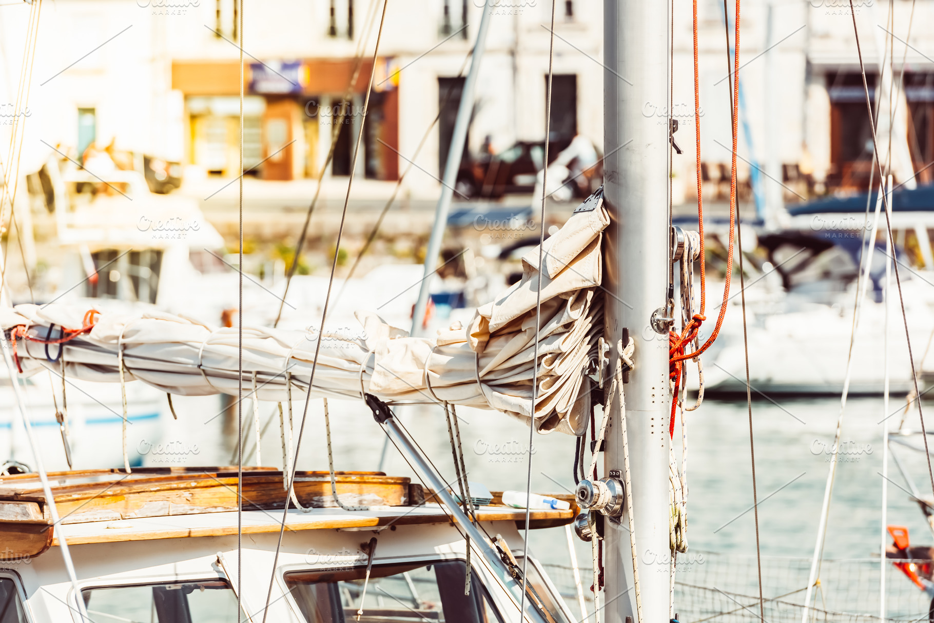 Sailboat mast with ropes in bustling, a Photo by Dvoevnore photos