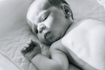 Portrait of a newborn on a baby changer, a Person Photo by rubenchase