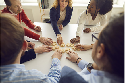 Happy diverse business team sitting, a Business Photo by StudioRomantic