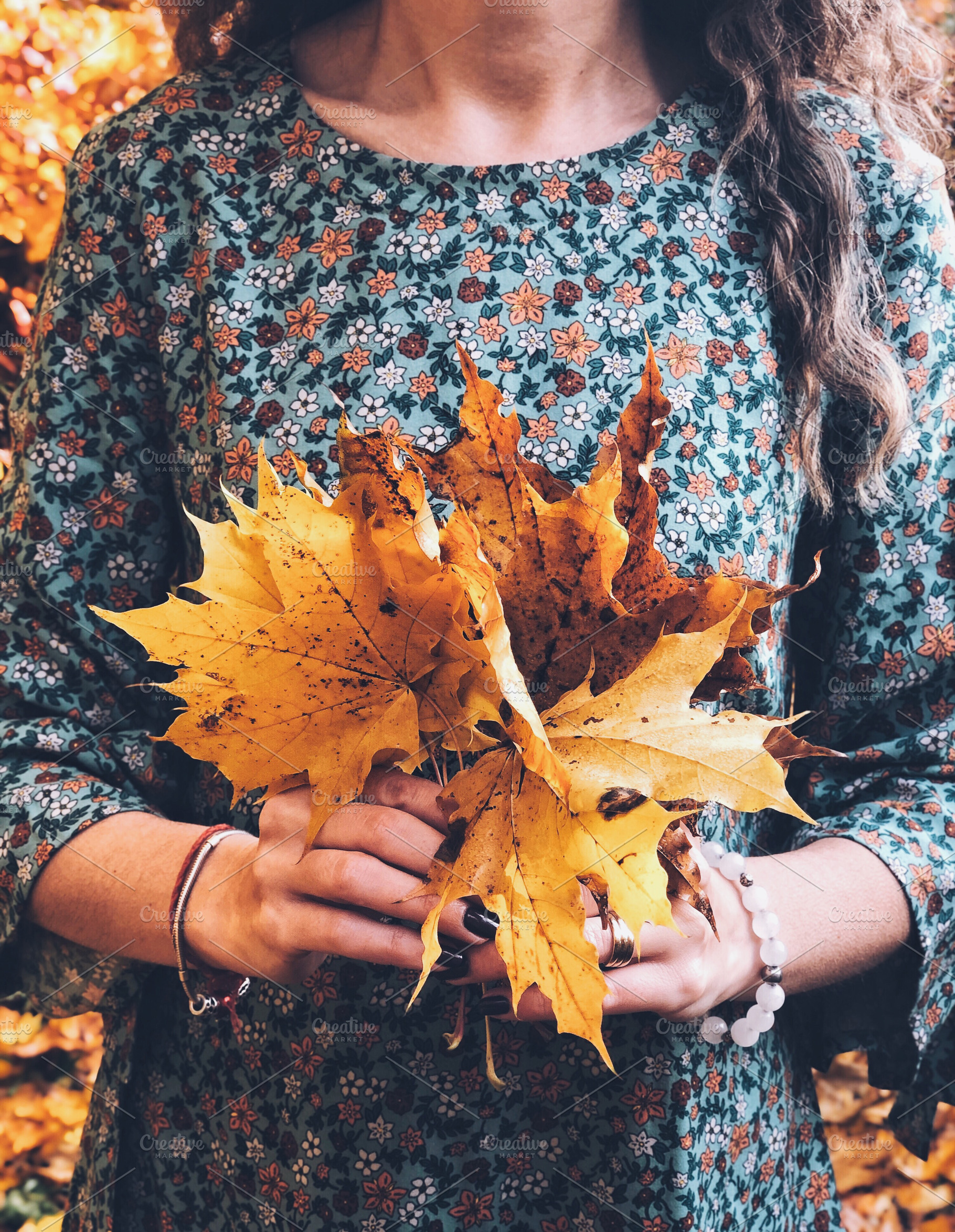Woman holding bunch of maple leaves, a Person Photo by so_lizaveta