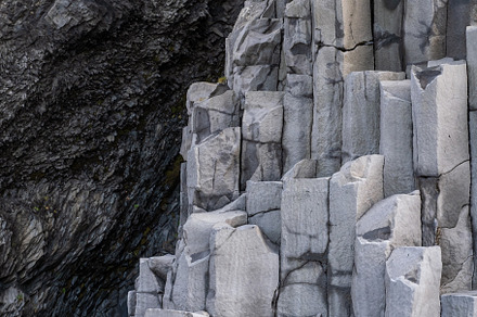 Basalt rock pillars columns at Reynisfjara beach near Vik, South, a Background Photo by YuriyB