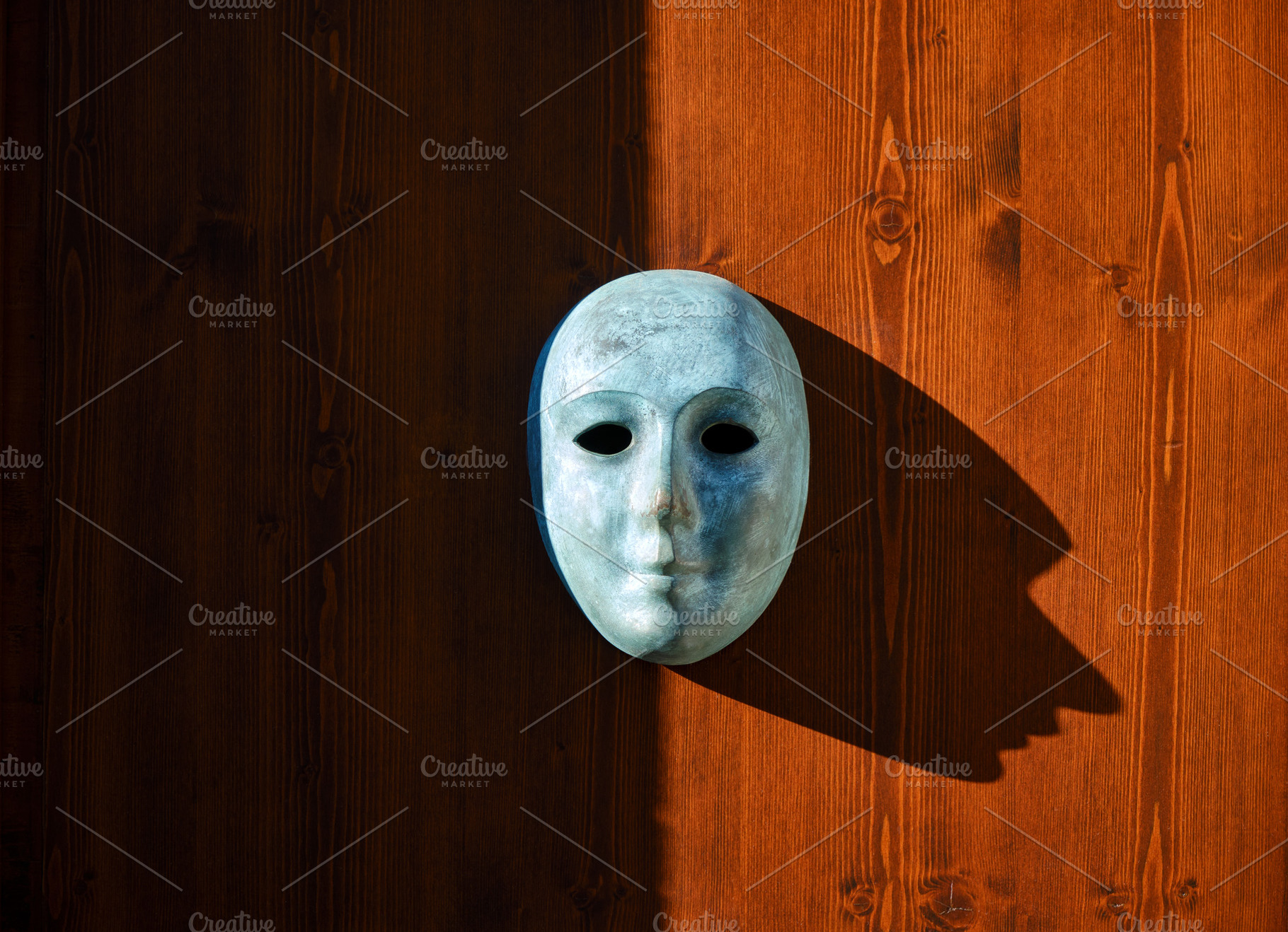 Venetian mask on wooden background, an Arts & Entertainment Photo by BOOCYS