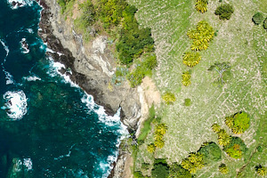 Coastline from above featuring coast, coastline, and rocks