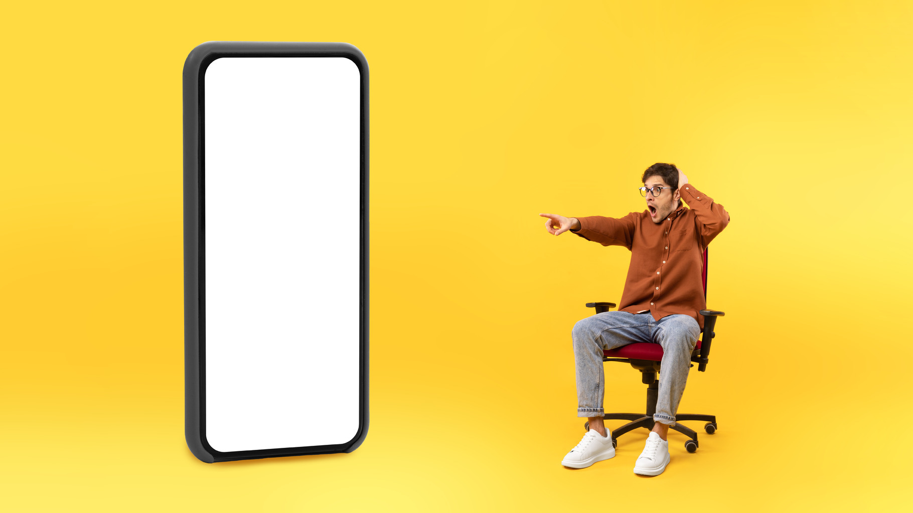 Man Pointing Finger Aside At Huge Phone Screen, Yellow Background, a ...