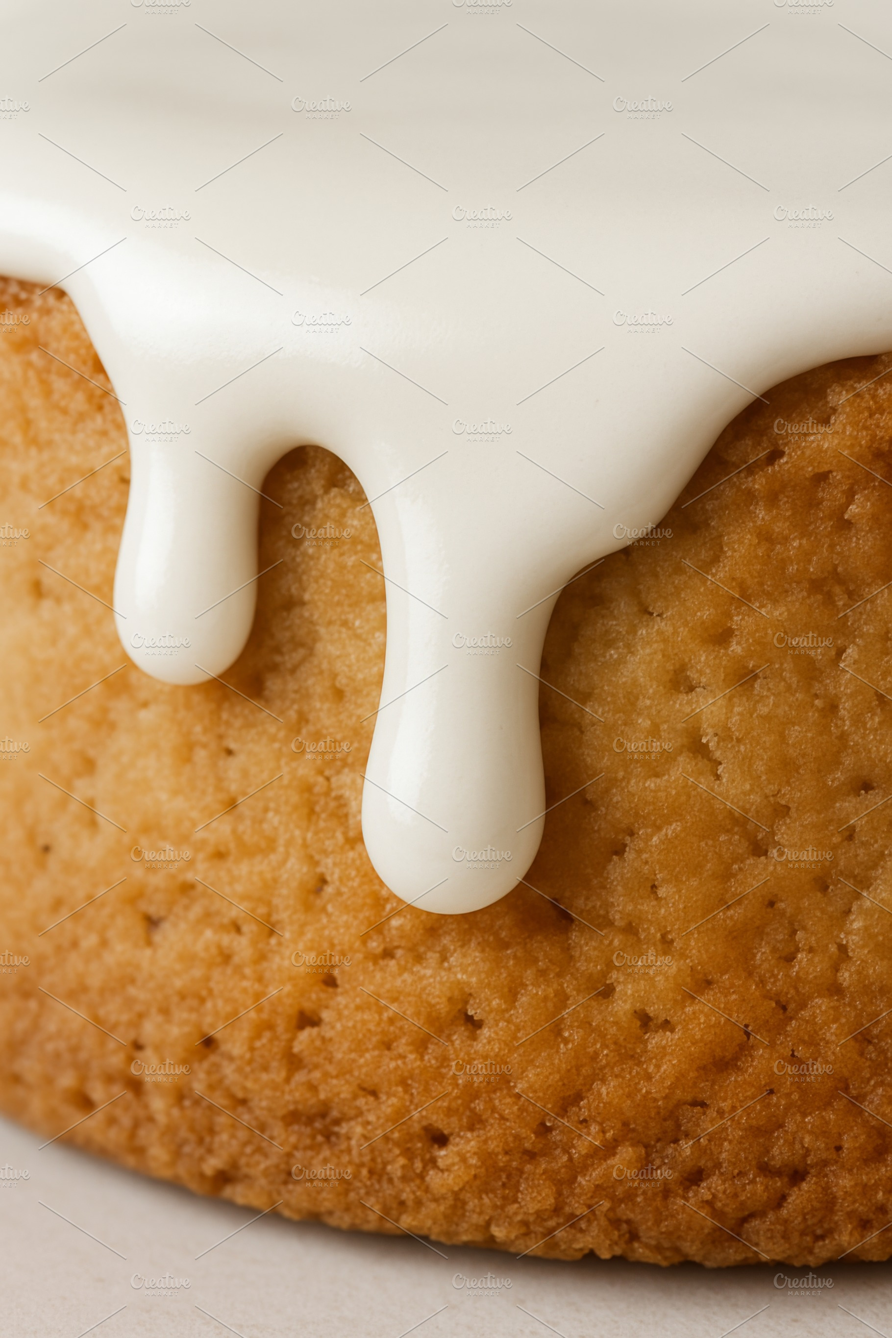 Cake closeup with white icing drippi, a Photo by Dvoevnore photos