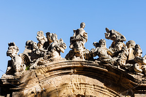 View of people and monster sculptures made of tuff in the Villa Palagonia, an Arts & Entertainment Photo by Bepslabor