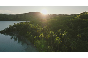Sun shining over tropical island, a Nature Photo by Goinyk