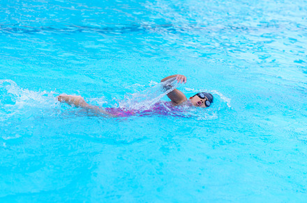 child swimmer swim in swimming pool. Water sports training and c, a Sports & Recreation Photo by Casanowe-studio