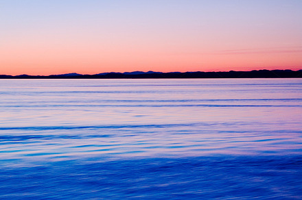 A calm lake and a gorgeous sunset, a Photo by Peopleimages.com