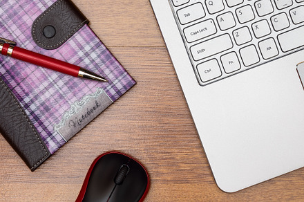 Top view on the desktop featuring laptop, notebook, and netbook, a Business Photo by photoWorkshop