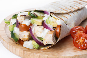 A delicious grilled chicken wrap with vegetables and avocado, a Food & Drink Photo by etorres69