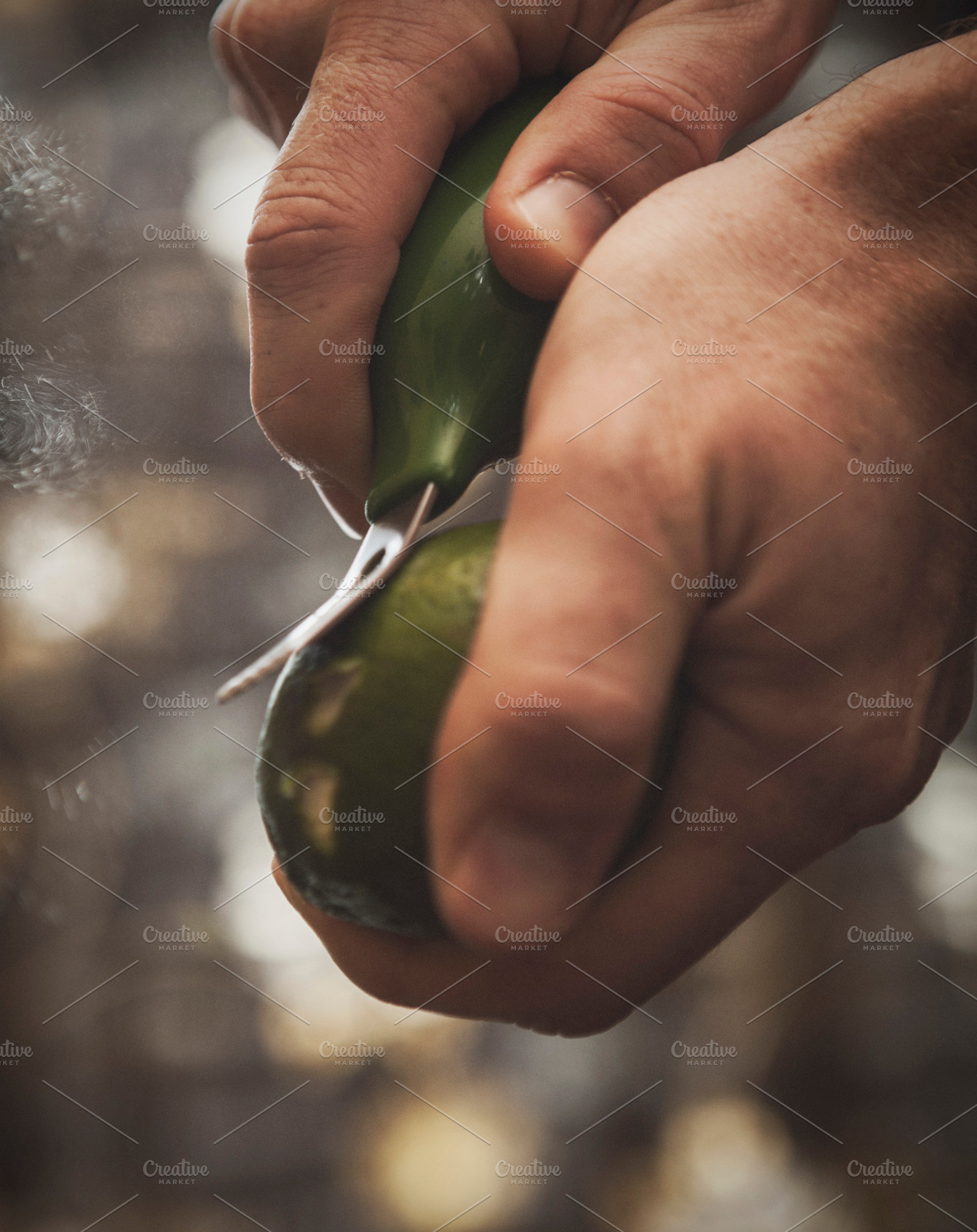 Zesting a lime stock photo containing limes and green
