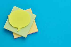 Multicolored thought cloud-shaped sticky notes on a square block, a School & Education Photo by ndanko