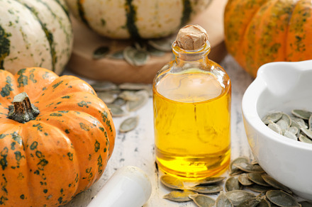 Pumpkin seeds oil bottle, pumpkins
