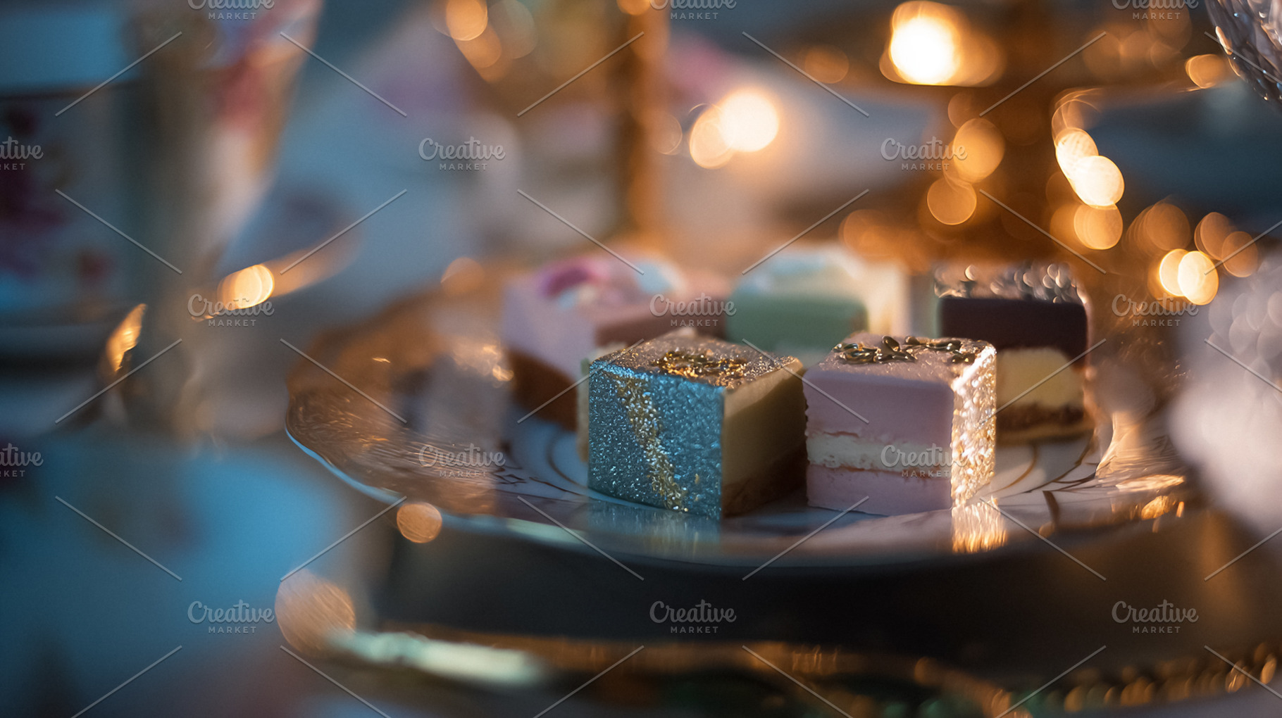 Petit fours arranged on an elegant serving plate, creating a fes, a Photo by Studio ANNA