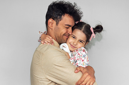 Loving father hugging his daughter a