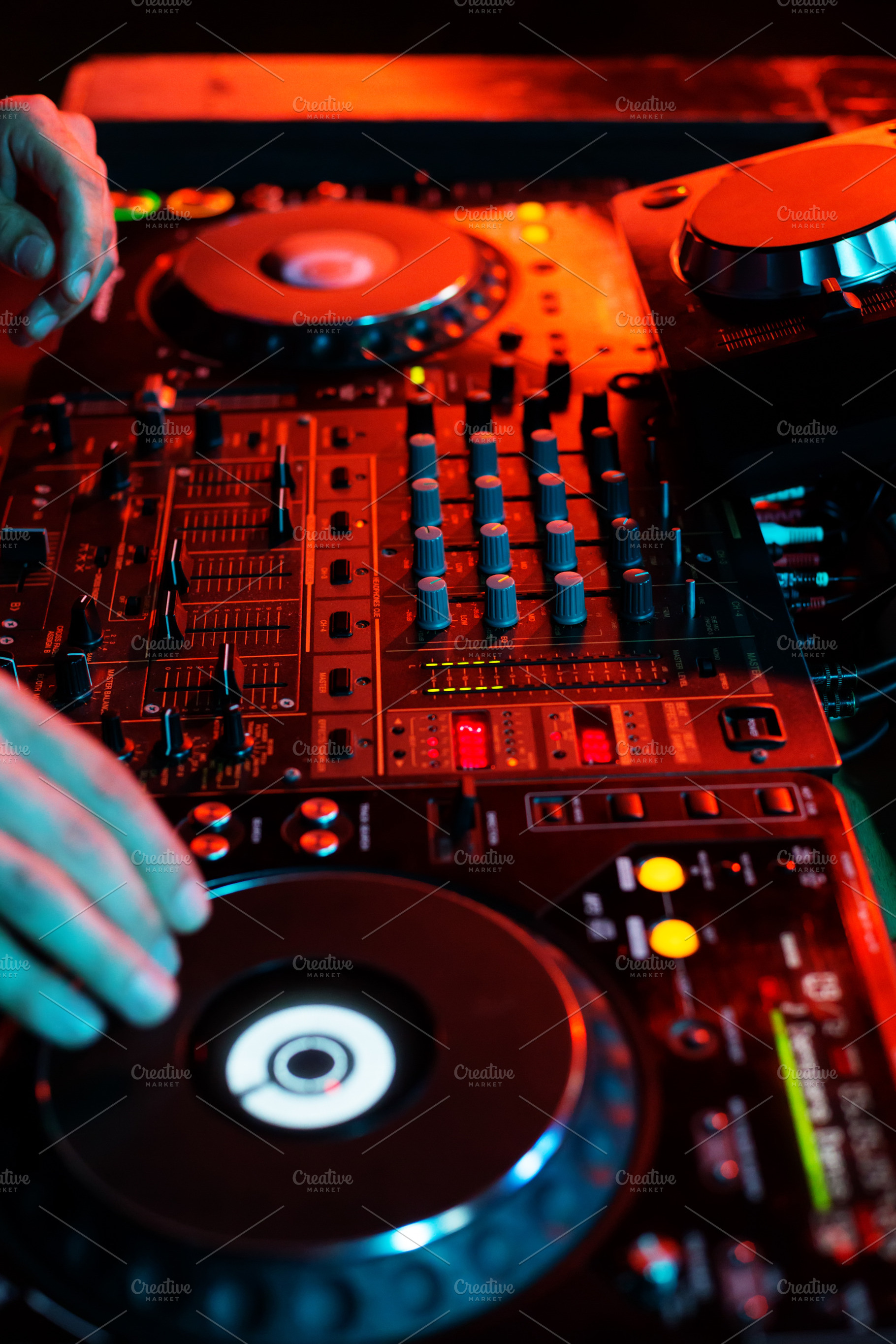 DJ playing music in night club party, a Background Photo by Kate Molchanova