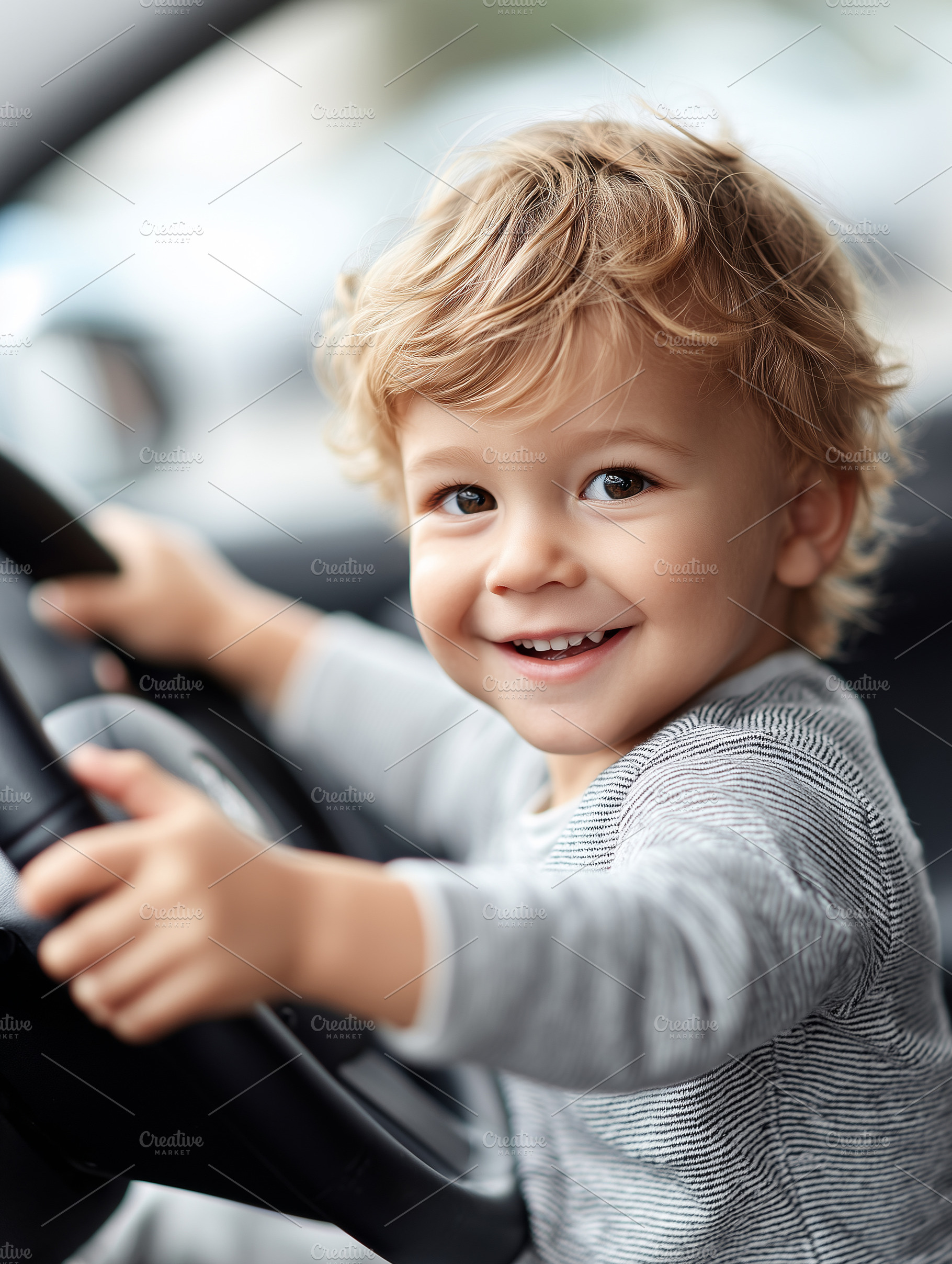 Smiling toddler boy holding wheel, a Transportation Photo by MistyDay