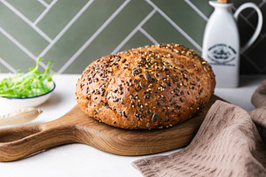 Homemade rye bread with seeds on a w, a Food & Drink Photo by Edalin's Store