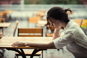 sad girl in cafe