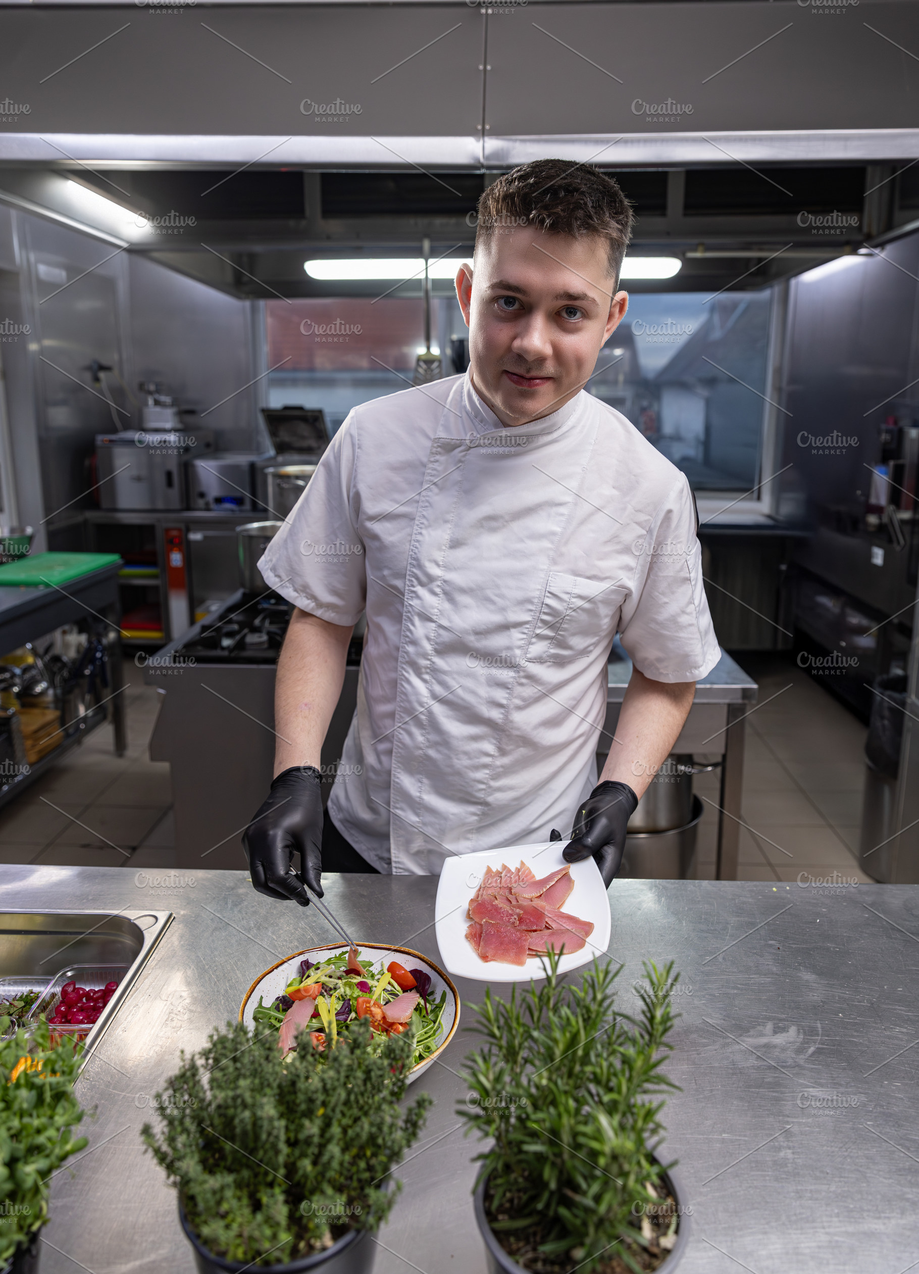 Chef preparing tuna salad, a Photo by Grafvision photography