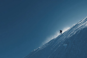 Climber ascends snowy mountain slope, a Photo by Beautiful things