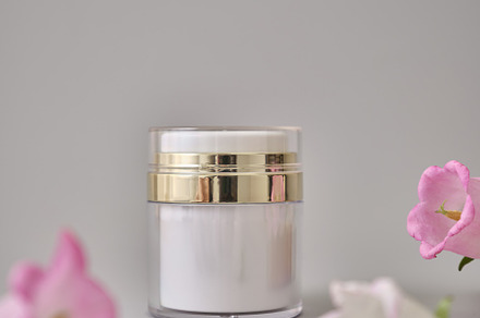 Skincare products on neutral background. Mockup bottles and flow
