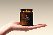 Candle Mockup on Hand, a Household Mockup by Design Squad (Thumbnail 1 of 4)