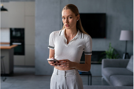 Female in white clothing at home