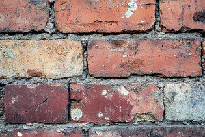 Closeup of weathered brick wall, a Photo by Pavel_design