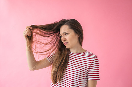The girl is not happy with her hair stock photo containing woman and fashion