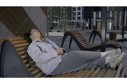 A beautiful woman resting on the, a Person Photo by Media Whale Stock