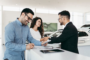 Car dealership showroom featuring buying, car, and showroom